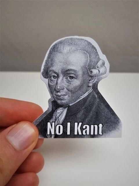 a person holding a sticker of a man's face